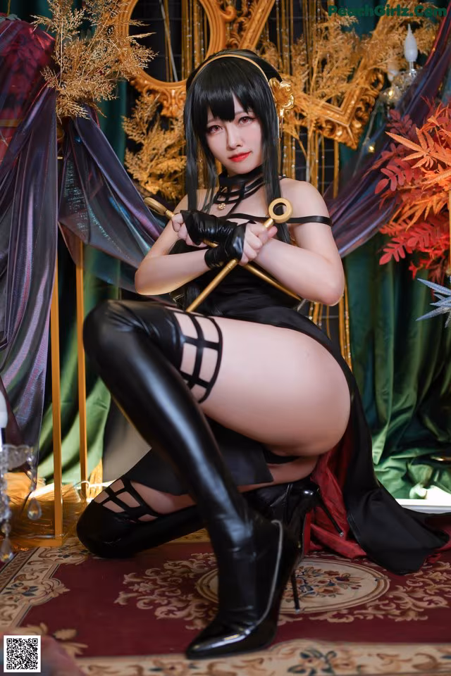 A woman in a black dress and thigh high boots posing for a picture.